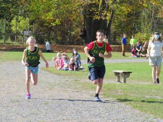 Prince Charles PS students Allie and Jon run the cross country course.